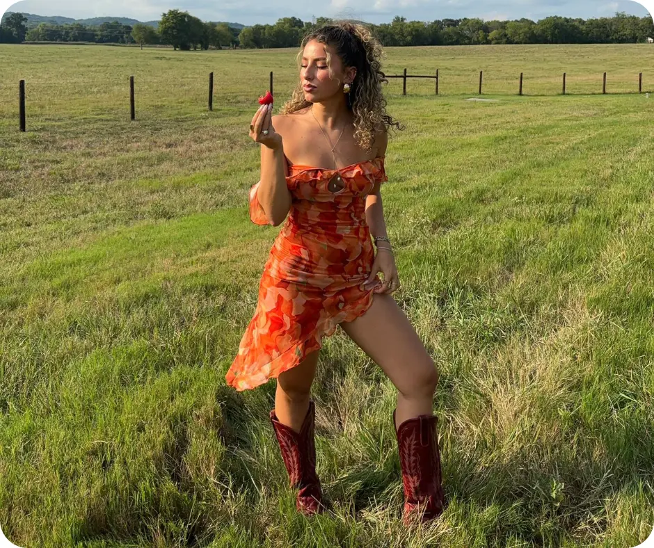 Gia Duddy in farm eating strawberry