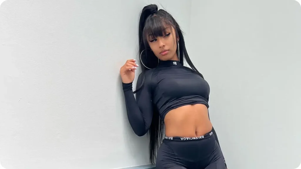 Rubi Rose sitting stunning pose with wall